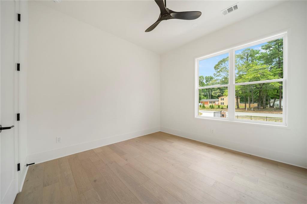 210 Simonton Road Southwest Lawrenceville, GA 30046 - Photo 42 of 55 an empty room with a window