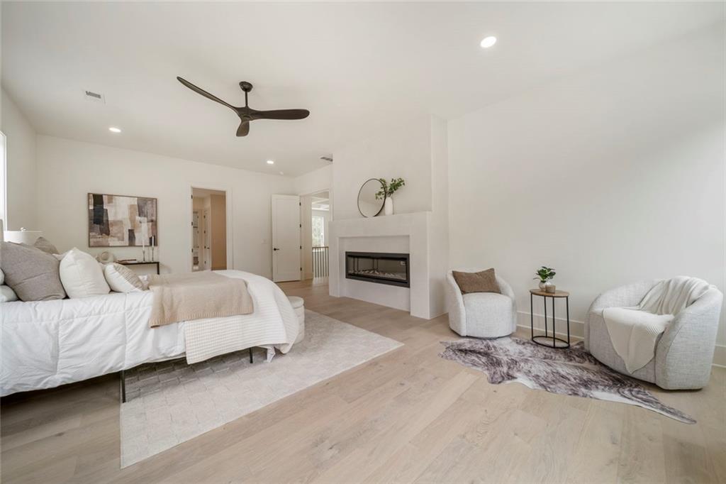 210 Simonton Road Southwest Lawrenceville, GA 30046 - Photo 45 of 55 a spacious bedroom with a bed and a couch