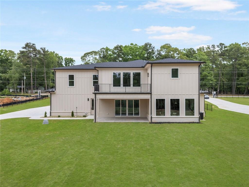 210 Simonton Road Southwest Lawrenceville, GA 30046 - Photo 55 of 55 a house view with a garden space