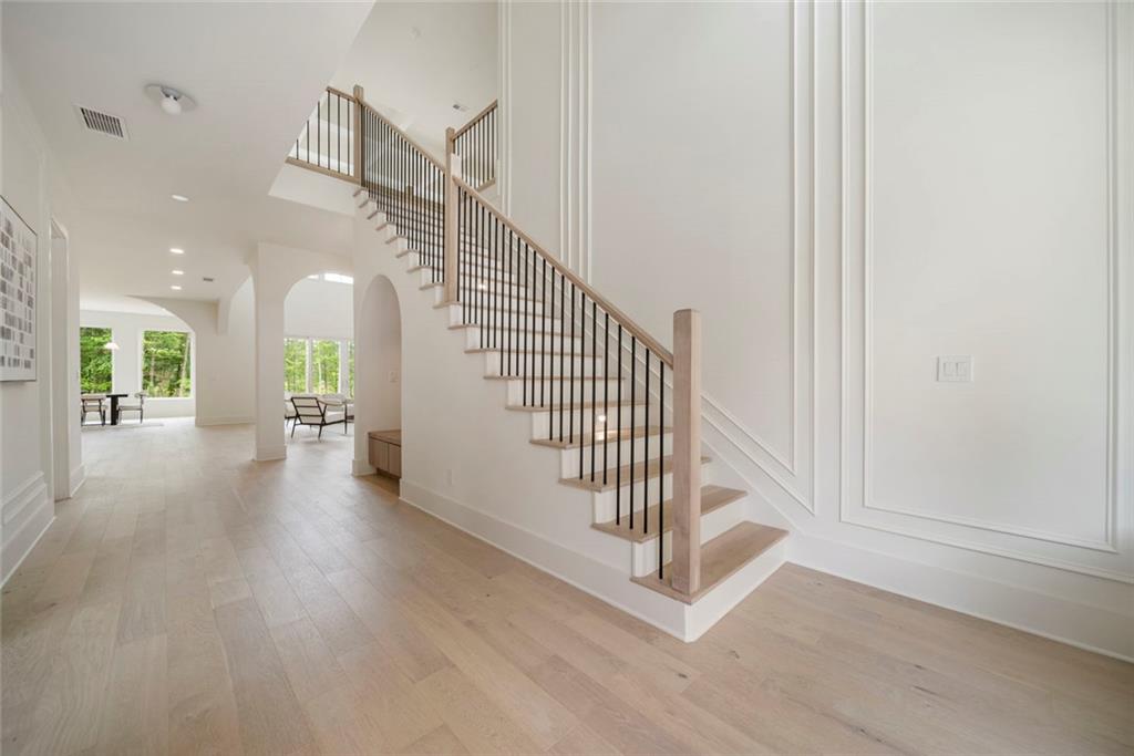 210 Simonton Road Southwest Lawrenceville, GA 30046 - Photo 9 of 55 a view of a hallway with staircase