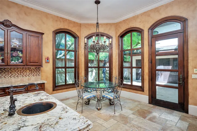 a living room with furniture and floor to ceiling windows
