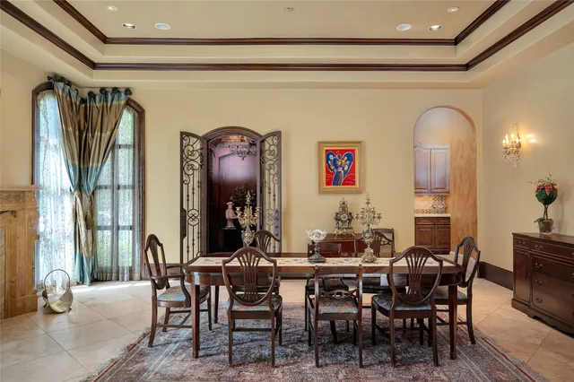 a living room with furniture a rug and a potted plant