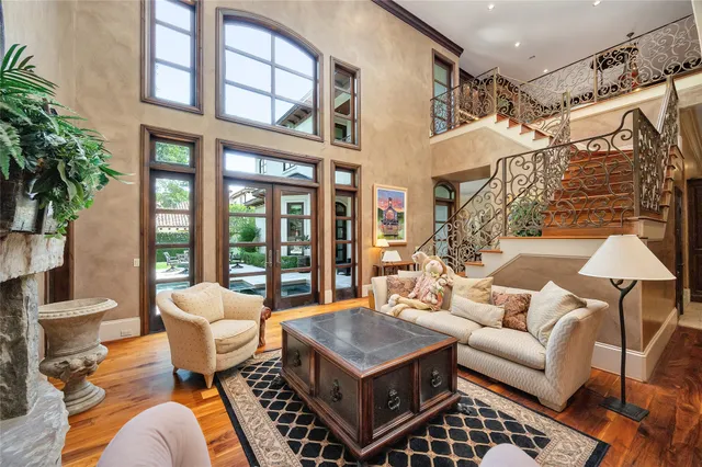 a living room with furniture and a clock