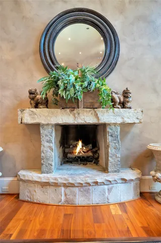 a living room with furniture and a mirror