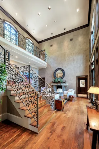 a bedroom with a bed couch and window