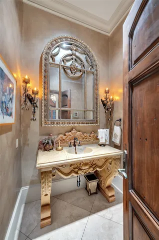a spacious bathroom with a tub sink and mirror