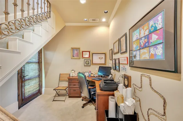 a view of a livingroom with workspace and a window