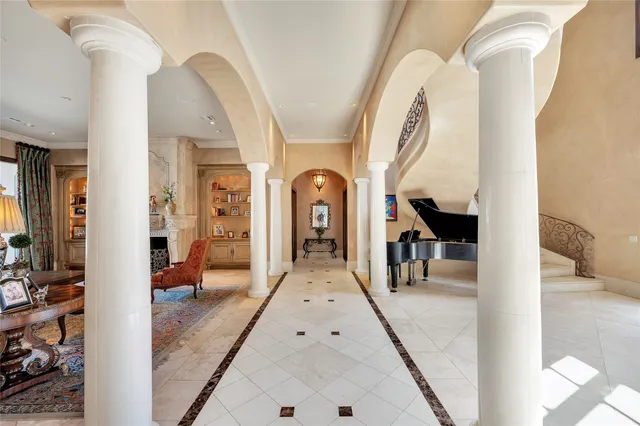 a view of living room kitchen and entryway