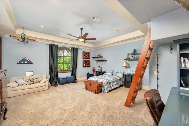 a view of a living room and a kitchen with a floor to ceiling window