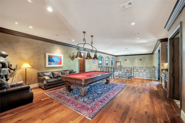 a bedroom with furniture a bed and a chandelier