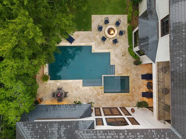 a view of a house with sitting area and chairs in front of house