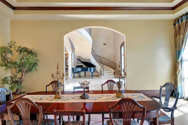 a dining room with furniture and wooden floor