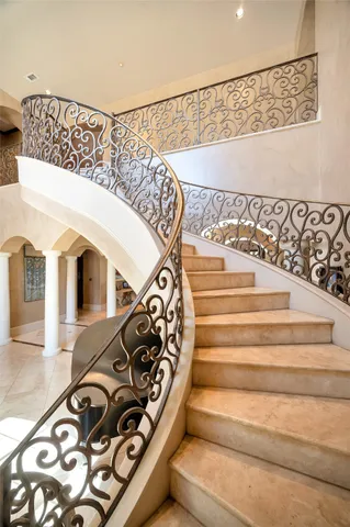 a view of staircase with a rug