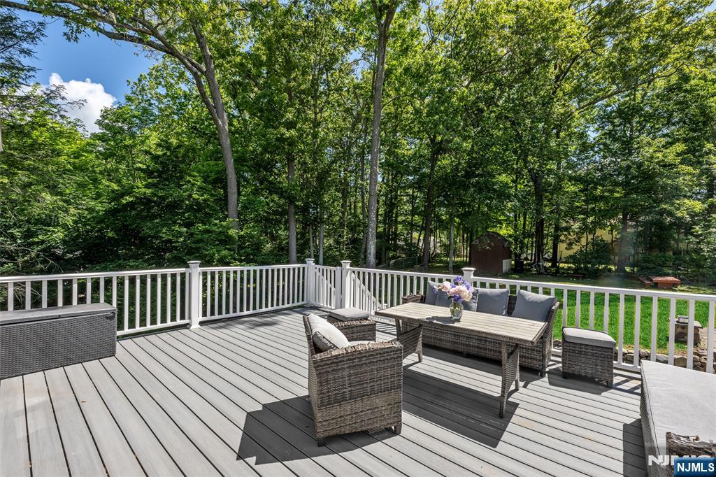 21 Marcia Road Ringwood, NJ 07456 - Photo 31 of 42 a view of a wooden deck with furniture