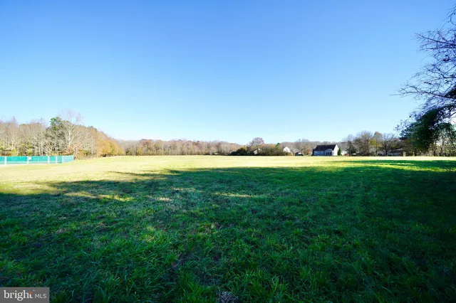 a view of an outdoor space and a lake view in back