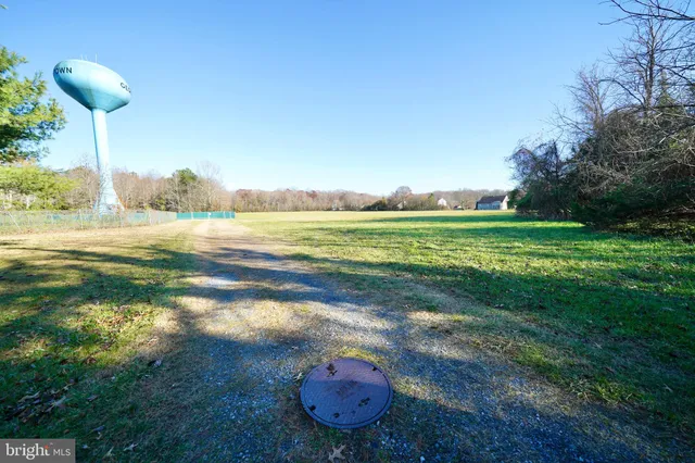 a view of a golf course with a lake view