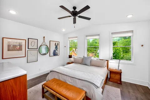 a bedroom with a bed and window