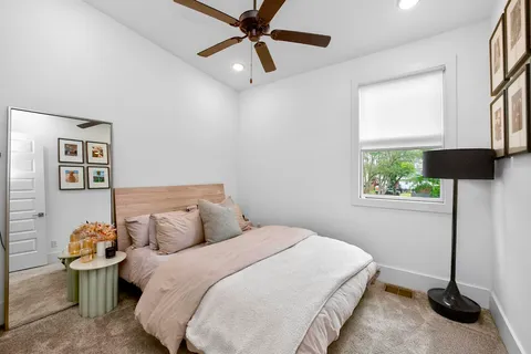 a bedroom with a bed and a window
