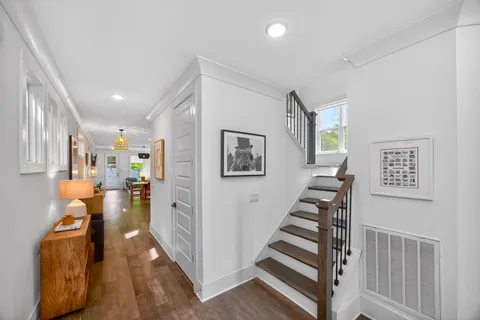 a view of entryway and hall with wooden floor
