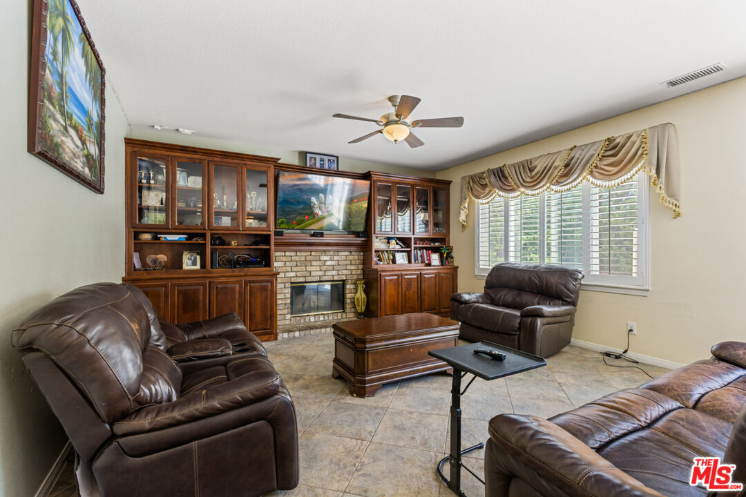 8256 Daisy Lane Riverside, CA 92508 - Photo 11 of 29 a living room with furniture ceiling fan and a window