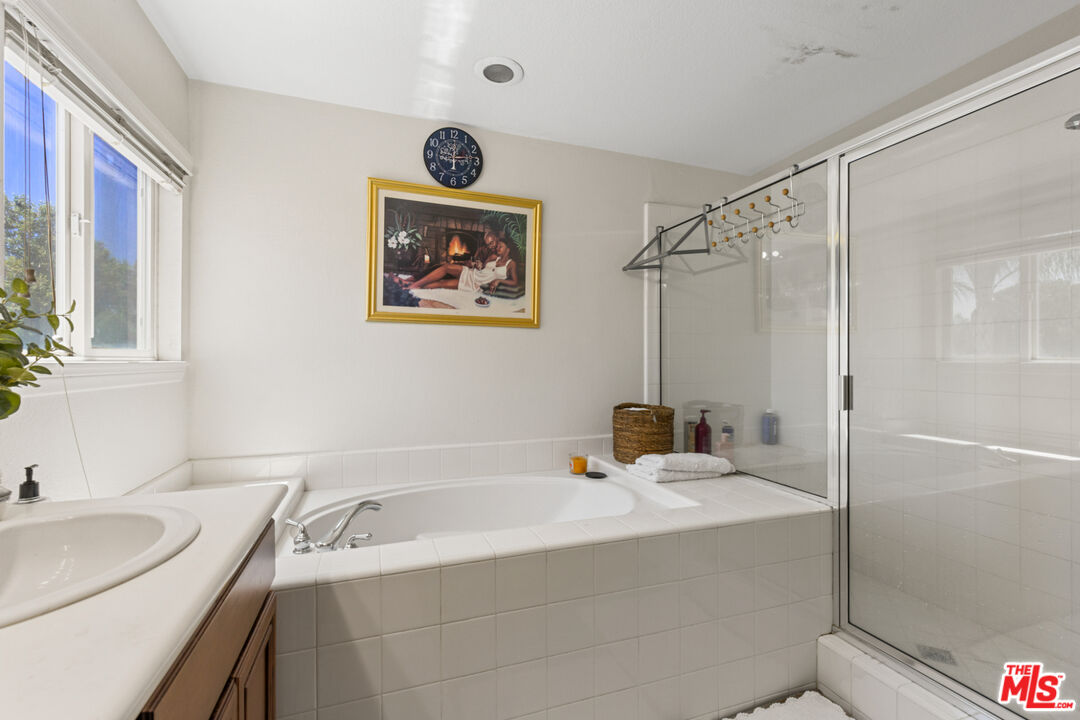 8256 Daisy Lane Riverside, CA 92508 - Photo 16 of 29 a bathroom with a sink and a mirror