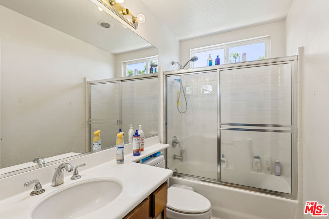 8256 Daisy Lane Riverside, CA 92508 - Photo 18 of 29 a bathroom with a sink toilet and shower