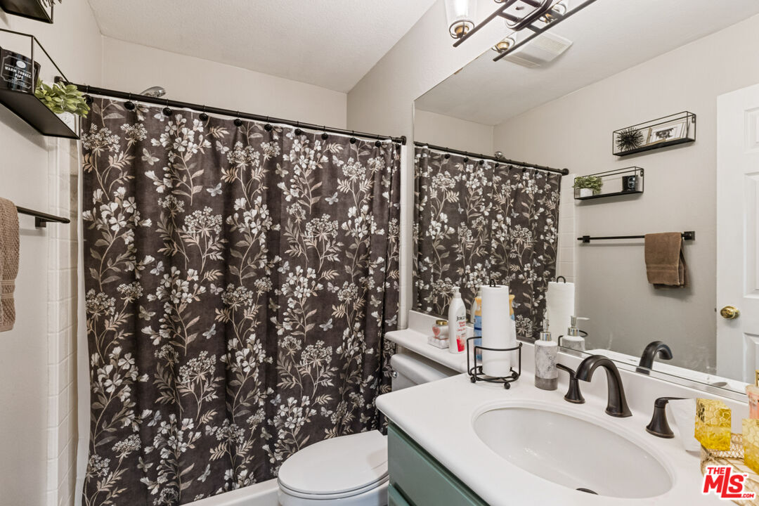 8256 Daisy Lane Riverside, CA 92508 - Photo 21 of 29 a bathroom with a sink toilet and shower