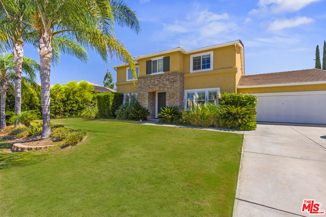 8256 Daisy Lane Riverside, CA 92508 - Photo 3 of 29 a front view of a house with a yard