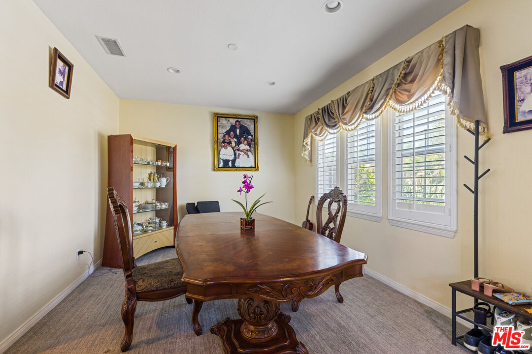 8256 Daisy Lane Riverside, CA 92508 - Photo 7 of 29 a view of a dining room with furniture and window