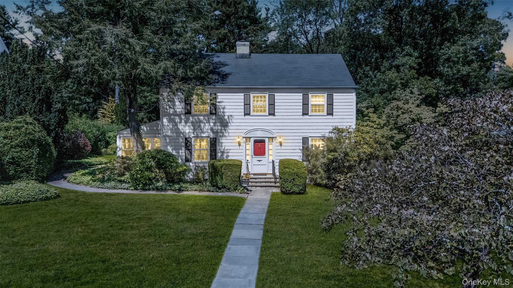 100 Lord Kitchener Road New Rochelle, NY 10804 - Photo 1 of 1 a front view of a house with a yard and trees