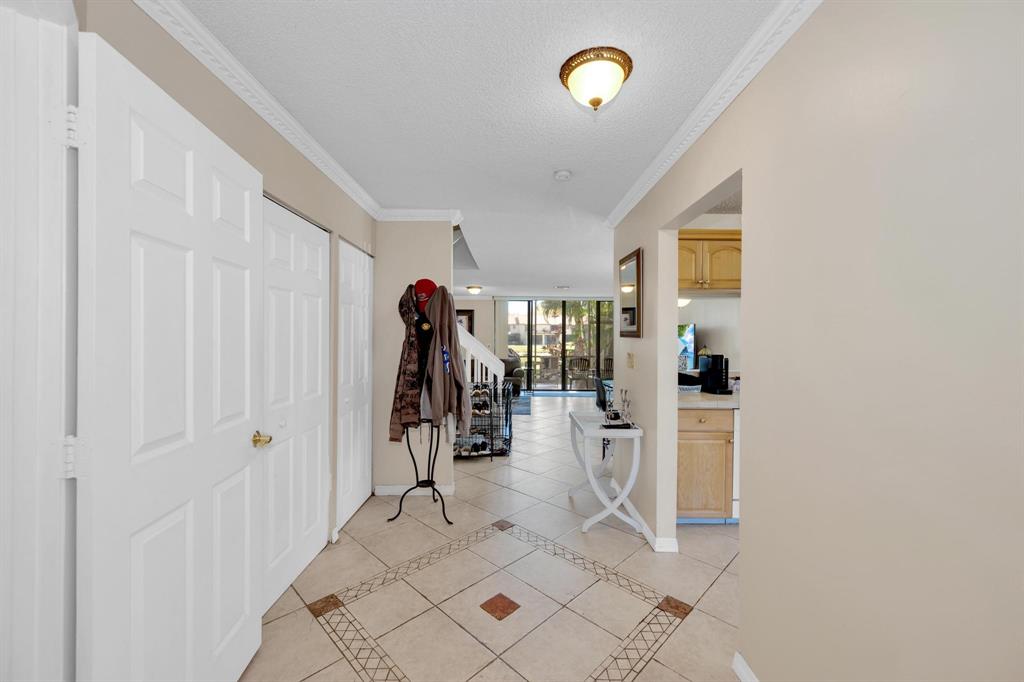 3963 Cocoplum Circle, Unit F Coconut Creek, FL 33063 - Photo 12 of 35 a view of a entryway with white walls