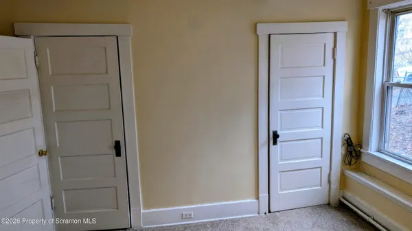 a view of hallway with closet