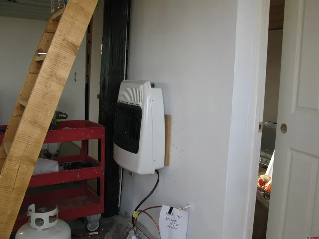 a room with wooden floor and furniture