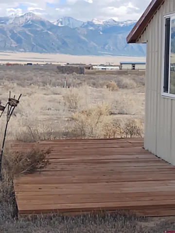 a view of a backyard with sitting area