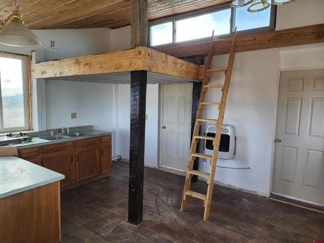 a view of a kitchen from the hallway