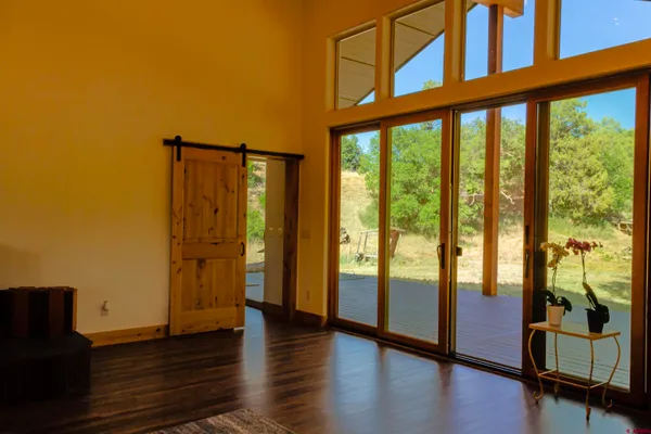 a view of an entryway with wooden floor