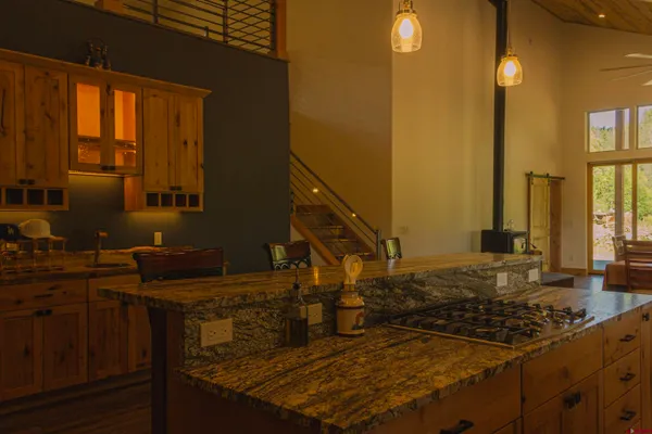 a kitchen with a sink stove and cabinets