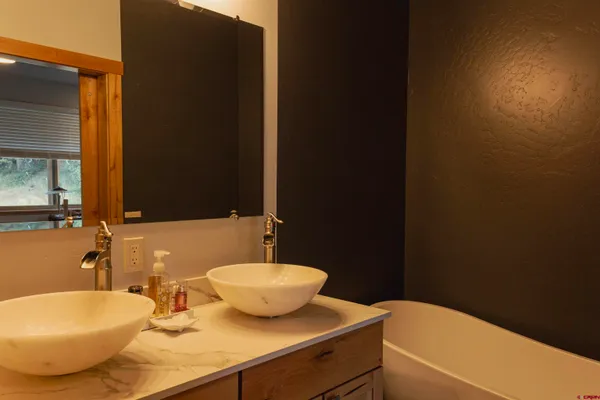 a bathroom with a sink and a mirror