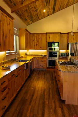 a large kitchen with wooden floor