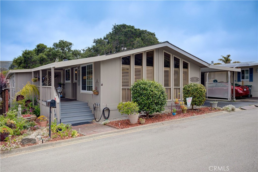 1675 Los Osos Valley Road, Unit 223 Los Osos, CA 93402 - Photo 1 of 68 a front view of a house with garden