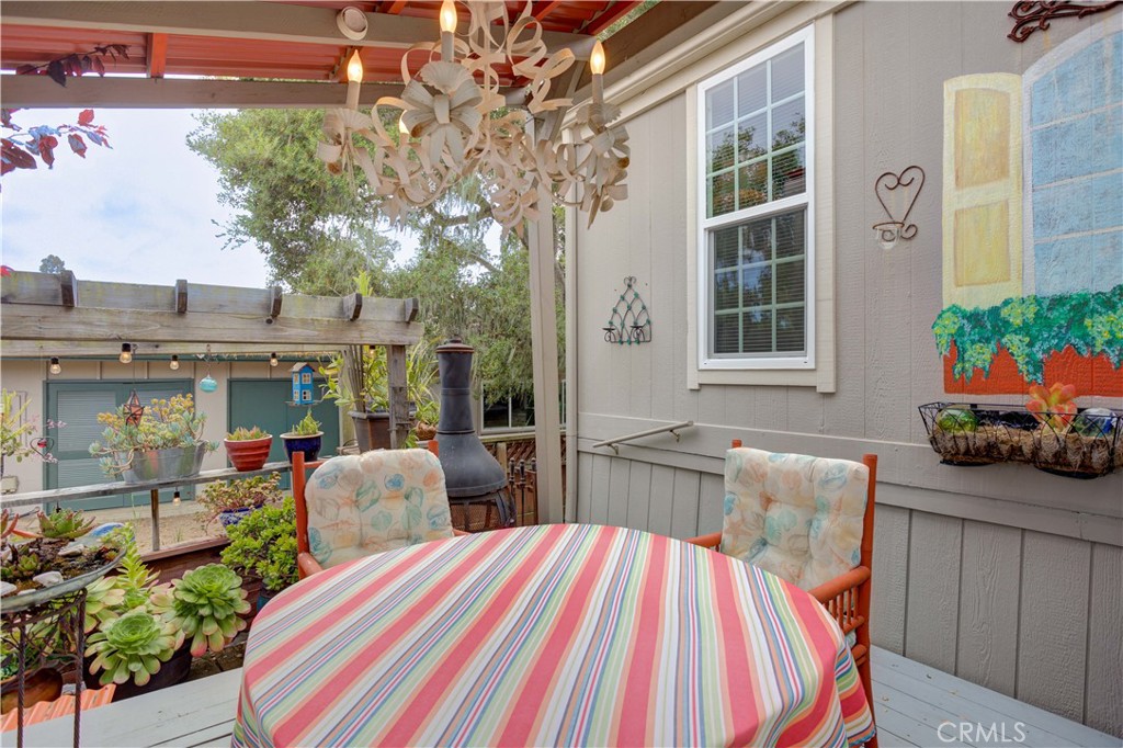 1675 Los Osos Valley Road, Unit 223 Los Osos, CA 93402 - Photo 13 of 68 a view of a house with backyard and sitting area