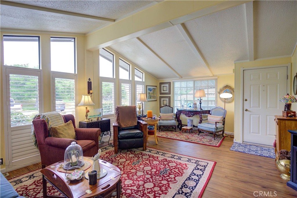 1675 Los Osos Valley Road, Unit 223 Los Osos, CA 93402 - Photo 20 of 68 a living room with furniture large rug and windows