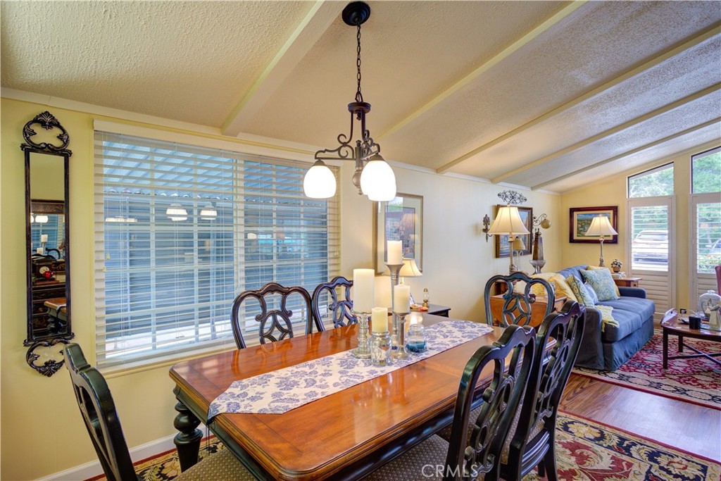 1675 Los Osos Valley Road, Unit 223 Los Osos, CA 93402 - Photo 22 of 68 a view of a dining room with furniture window and outside view