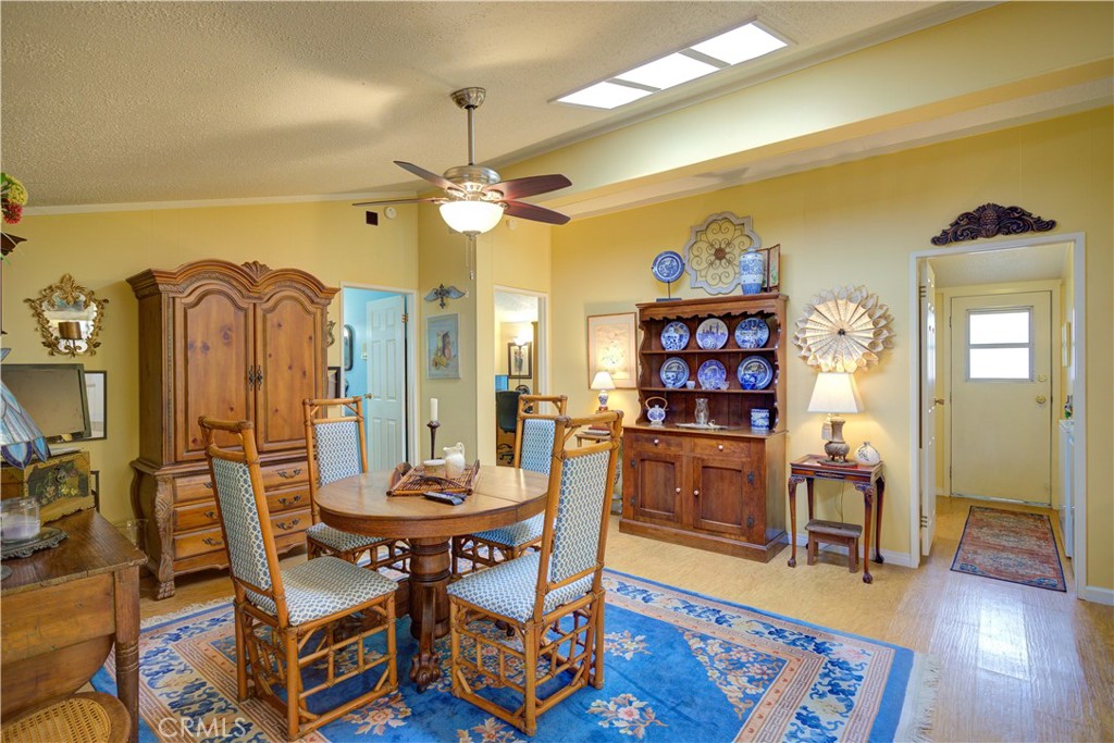 1675 Los Osos Valley Road, Unit 223 Los Osos, CA 93402 - Photo 27 of 68 a view of a dining room with furniture and wooden floor