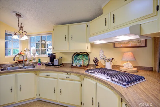 a bedroom with a bed a mirror on dresser and a large mirror