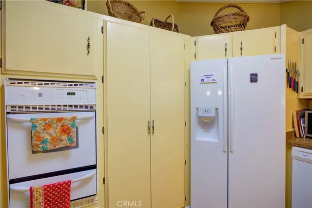 a bedroom with furniture and a flat screen tv