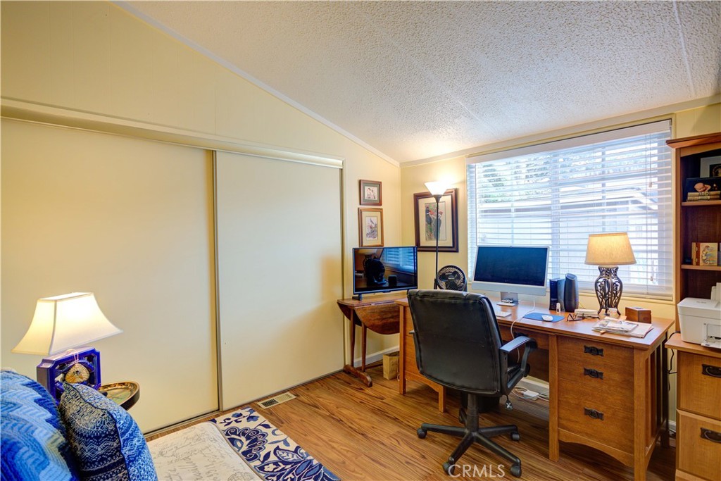 1675 Los Osos Valley Road, Unit 223 Los Osos, CA 93402 - Photo 34 of 68 a view of a workspace with furniture and a window