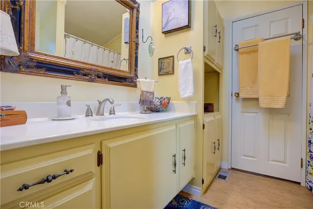 a living room with furniture a table and a potted plant