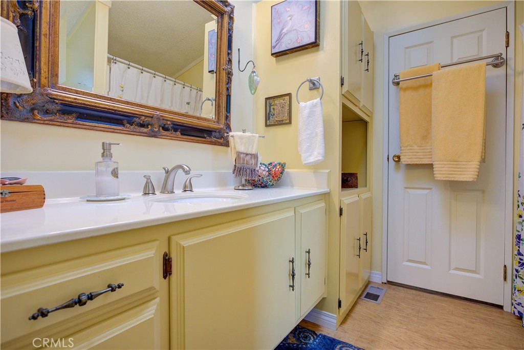 1675 Los Osos Valley Road, Unit 223 Los Osos, CA 93402 - Photo 37 of 68 a bathroom with a sink and a mirror