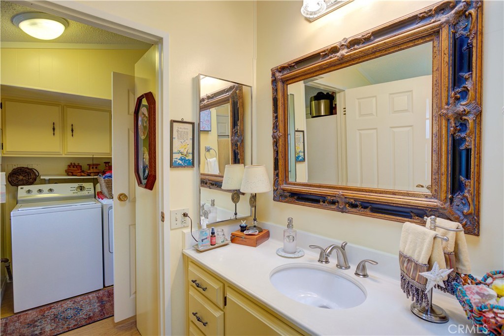 1675 Los Osos Valley Road, Unit 223 Los Osos, CA 93402 - Photo 38 of 68 a bathroom with a sink double vanity and a mirror